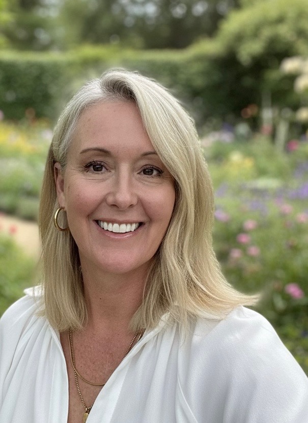 Portrait of Lauren smiling in a garden